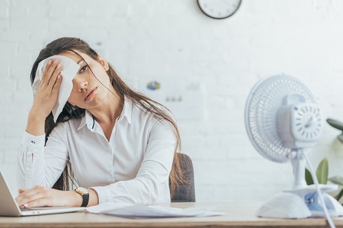 Hot Office Worker iStock LightFieldStudios