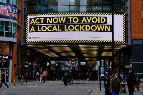 Market Street, Manchester on 17 October. Signage puts the agency on people to avoid a second lockdown