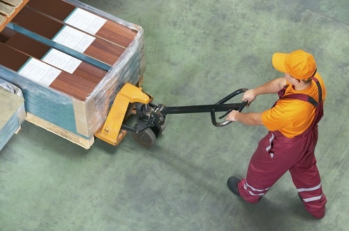 Man Pushing Pallet iStock/kadmy