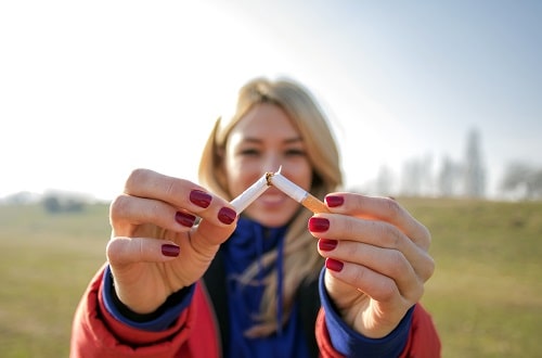 Woman Snapping Cigarette iStock PixelsEffect