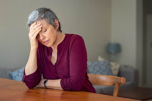 Older Lady Head in Hands iStock Ridofranz