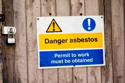 Causing an average of 5,000 deaths per year in the UK alone, it is a well-known fact that exposure to asbestos can have a range of severe health consequences. Asbestos-containing materials (ACMs) are the most hazardous to health when disturbed or damaged as a result of maintenance or demolition work, as this allows the fibrous mineral to become airborne and potentially inhaled, increasing the risk of asbestos-related diseases, such as lung cancer, mesothelioma and asbestosis.  What are the legal requirements for duty holders in terms of managing the risks posed by asbestos?  Despite being classed as a hazardous substance when disturbed, asbestos is actually excluded under the Control of Substances Hazardous to Health Regulations (COSHH) 2002. In fact, Regulation 5 of COSHH specifically states that the requirement to carry out COSHH assessments – in addition to all employer duties regarding assessment, controls, monitoring and surveillance – does not apply to asbestos.   This is due to the fact that the substance comes with its own set of regulations – the Control of Asbestos Regulations (CAR) 2012 – which are actually considered to be stricter due to the highly hazardous nature of the substance.  If you own, occupy, have access to or manage the maintenance and repair of premises which may contain asbestos, you are classed as the ‘duty holder’ and are legally required under Regulation 4 of CAR 2012 to adequately manage this risk. Known as the ‘Duty to Manage’, the legislation applies to all non-domestic buildings, including commercial, public and industrial premises. Duty holders for all of these buildings must take the following steps to manage asbestos:  Undertake an inspection to identify and maintain a register of asbestos-containing materials (ACMs) in the building Assess the risks associated with ACMs in the premises Devise a risk management plan for the building and any ACMs Make sure occupants of the building know the risks and precautions they need to take Keep the management of asbestos in the building under review. With an estimated 500,000 buildings in the UK still thought to contain asbestos, it is a legal requirement under CAR 2012 for employers to inform all members of staff who may come into contact with ACMs in their day-to-day work about the precise location of the ACMs. In addition, employees must be fully trained and be able to respond competently and confidently in the event of them coming across any suspected or confirmed ACMs.  If ACMs are discovered on my premises, should removal be arranged with immediate effect?  In the event of unexpectedly disturbing an ACM, immediate action is required in terms of stopping work, closing/sealing the area and calling in a specialist to clear the site. However, there is often a misconception that merely identifying ACMs means they should be urgently removed, and this is not necessarily the case. In fact, just because asbestos may be present, it does not automatically mean that it is hazardous to health.  If sealed, undisturbed and found to be in good condition, legislation states that the asbestos present can be left alone and is not considered to be a health hazard, as the fibres should remain encapsulated. Removal of asbestos only tends to be an absolute requirement for materials found to be in bad condition, or, for items which are liable to ageing, damage and degradation, either as a result of normal building occupancy or planned building works.  Furthermore, refurbishment, demolition or maintenance work can all pose a risk of disturbing asbestos and increasing the risk of inhalation, which is why knowing the location of ACMs is fundamental to the long-term safe management of asbestos.  It is a legal requirement that, prior to the commencement of these types of work, duty holders locate ACMs and assess the level of risk they pose. Also, any recommendations for remedial actions must be documented, as it is often the case that managing ACMs in situ is less hazardous than removing them completely.  Is asbestos considered to be more hazardous to health in light of the increase in unoccupied premises over the course of the Covid-19 pandemic?  Given that CAR 2012 requires duty holders to manage asbestos to prevent or minimise exposure as far as is reasonably practicable, it is essential that both the short and long-term management of asbestos is not overlooked during the ongoing global pandemic. In fact, failing to regularly inspect, identify and manage ACMs will counteract your ‘Duty to Manage’ and could increase the risk of asbestos being disturbed and the resulting fibres subsequently being inhaled.   In the event of unexpectedly disturbing an ACM, immediate action is required in terms of stopping work, closing/sealing the area and calling in a specialist to clear the site. Photograph: iStock There is a reasonable chance that your scheduled asbestos reinspection or essential refurbishment works were due during one of the Covid-19 lockdowns and have had to be delayed as a result.  With the official roadmap to the easing of Covid-19 restrictions now in place, it is prudent for these inspections to be planned and completed to ensure that all ACMs are in a safe and compliant condition, allowing duty holders to safely reoccupy their buildings over the coming months.  Intrusive surveys should be undertaken prior to any planned building works, which may include any adaptations to provide additional barriers/segregation for Covid-19 mitigation measures. Not only will this further reduce the risk of asbestos exposure among your workforce, it also ensures that the risk of the spread of Covid-19 (which, as a biological agent, has also been classed as a hazardous substance), is kept at a minimum.  James Dodgson is Commercial director, Asbestos SOCOTEC UK