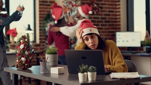 Stressed Worker in Santa Hat iStock Dragos Condrea